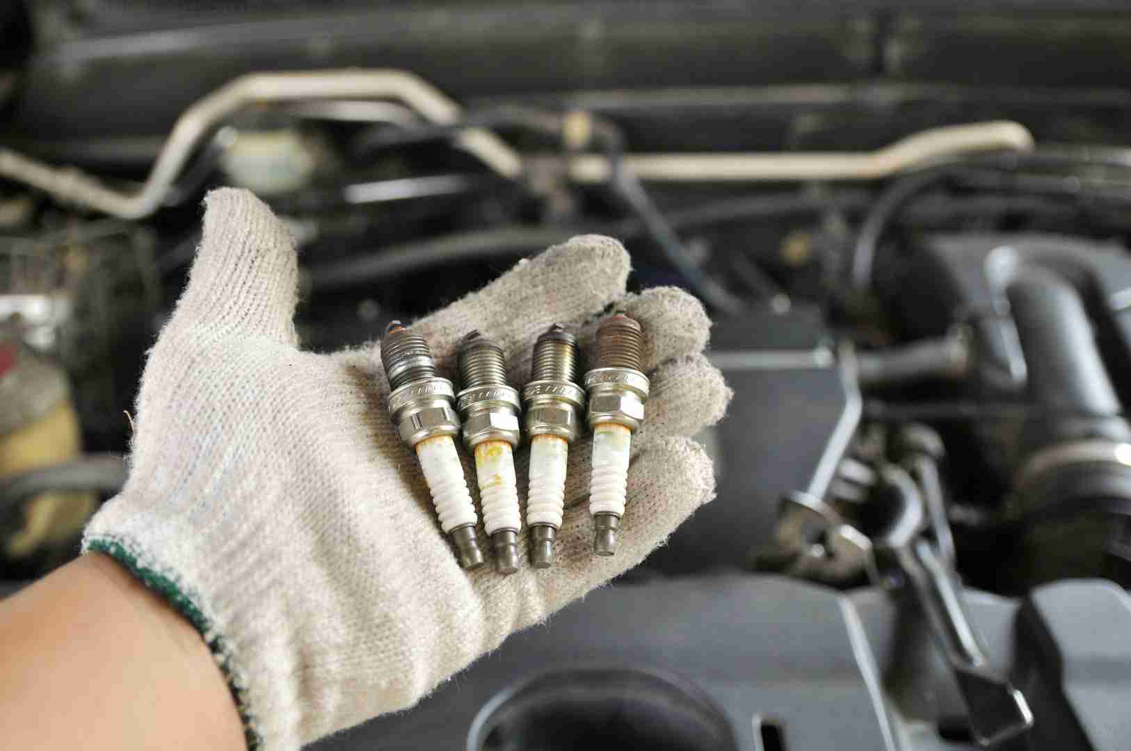 Spark plug replacement during car servicing in Manchester
